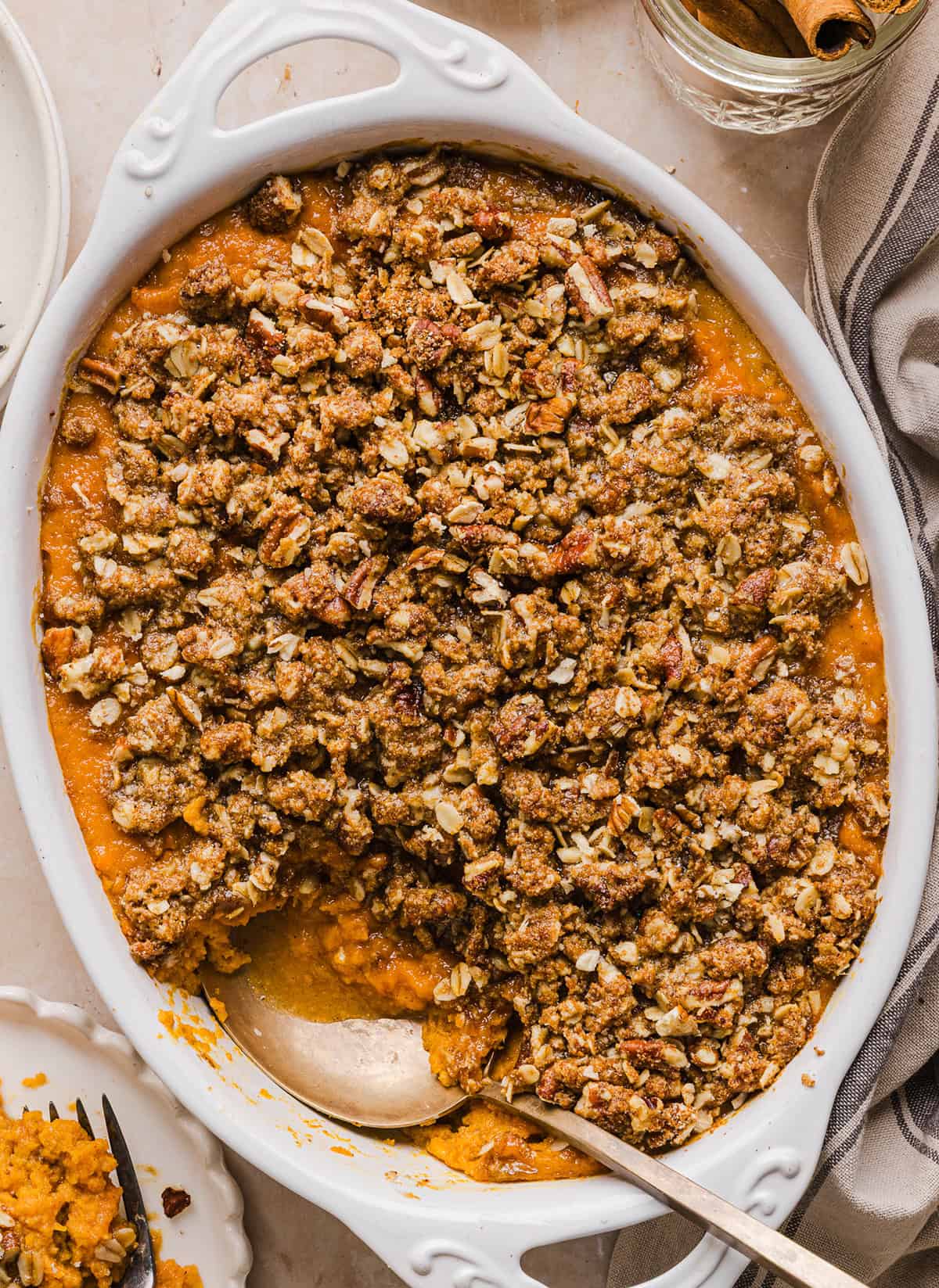 This Healthy Sweet Potato Casserole is a family favorite! A classic holiday side dish that tastes just as delicious as traditional sweet potatoes, but without any refined sugar and a wholesome pecan streusel topping!