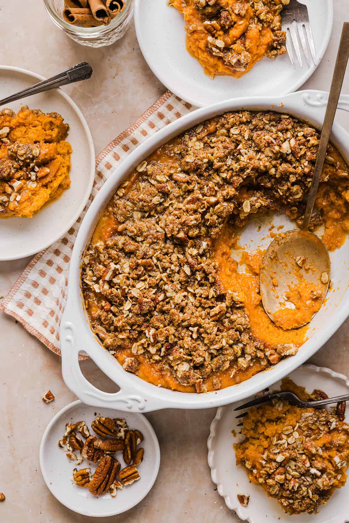 This Healthy Sweet Potato Casserole is a family favorite! A classic holiday side dish that tastes just as delicious as traditional sweet potatoes, but without any refined sugar and a wholesome pecan streusel topping!