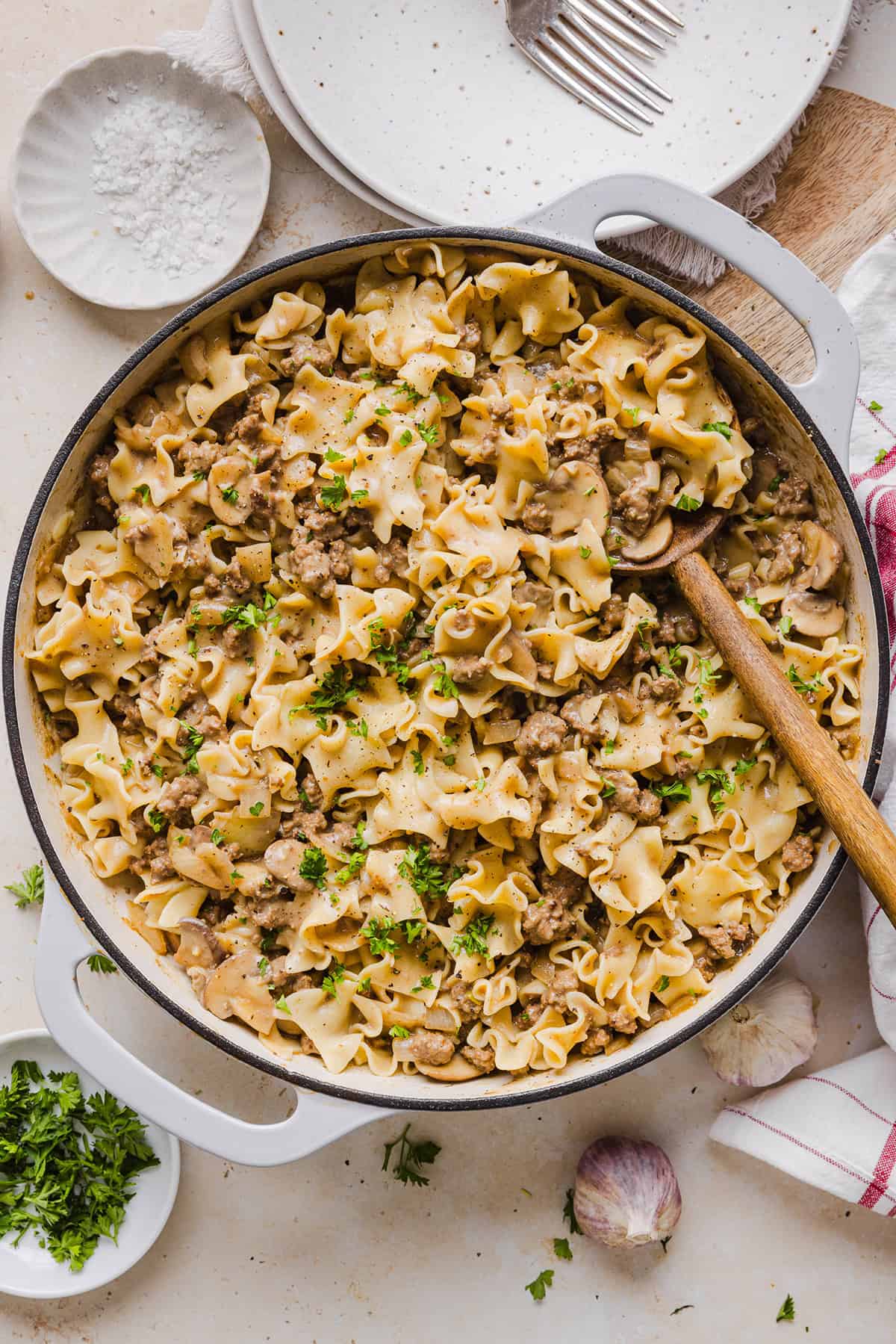 This Healthy Ground Beef Stroganoff Casserole is the ultimate family-friendly comfort food! The perfect cozy weeknight meal made with egg noodles and smothered in the most delicious creamy mushroom sauce in just 30 minutes!