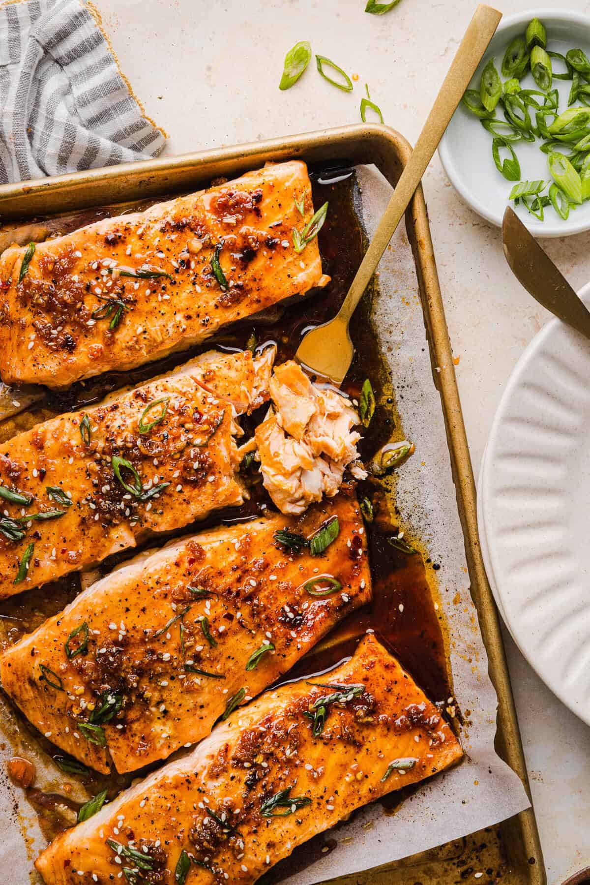 The most flavorful Hot Honey Glazed Salmon that is tender, flaky and coated in a sweet and savory homemade hot honey sauce. This simple healthy recipe easily comes together in under 20 minutes!