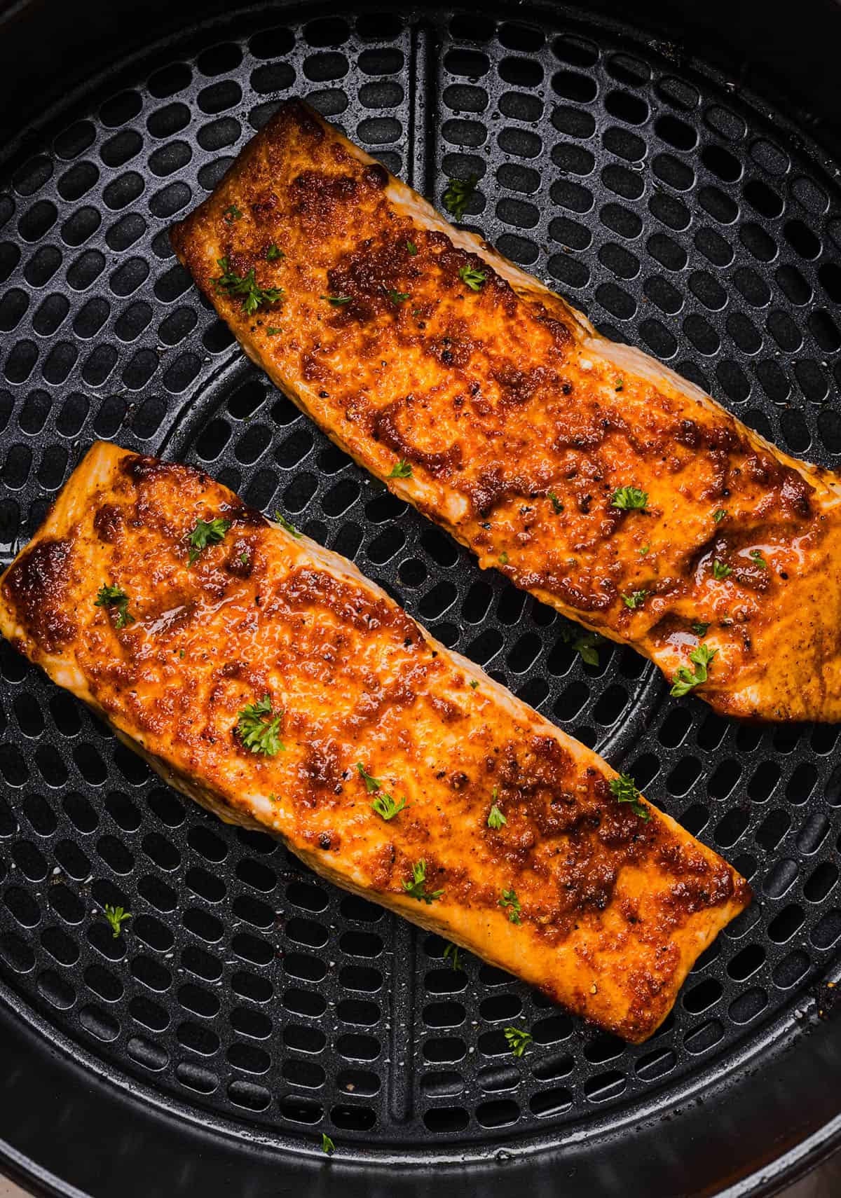 Easy Air Fryer Salmon that turns out perfectly flaky every time in under 10 minutes! Seasoned with a blend of spices for a delicious, healthy meal great for busy weeknights or when you need to meal prep.