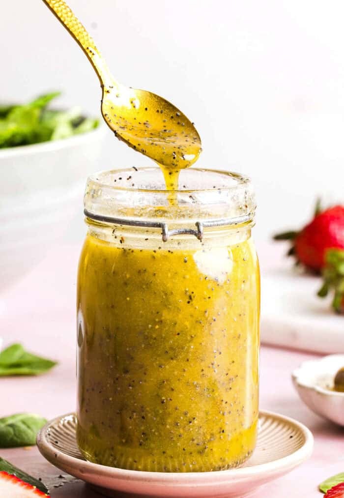 This Poppy Seed Dressing recipe is light, sweet and perfectly tangy made with simple ingredients in just 5 minutes! The perfect addition to fresh salads, fruit, or grilled chicken and tastes so much better than store-bought.