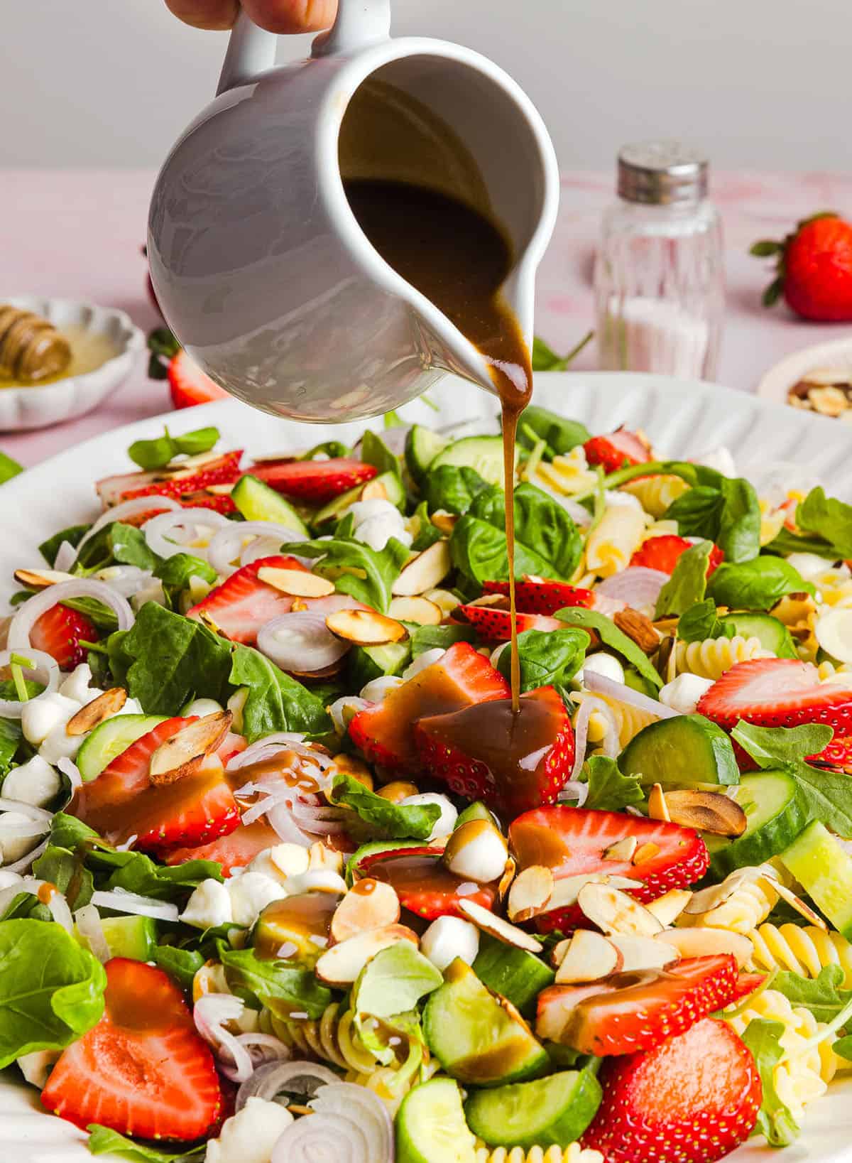 This Strawberry Balsamic Pasta Salad is fresh, flavorful, and perfect for spring and summer! Made with juicy strawberries, tender pasta, fresh basil, creamy mozzarella and crisp cucumbers all tossed in a lightly sweet balsamic dressing. 
