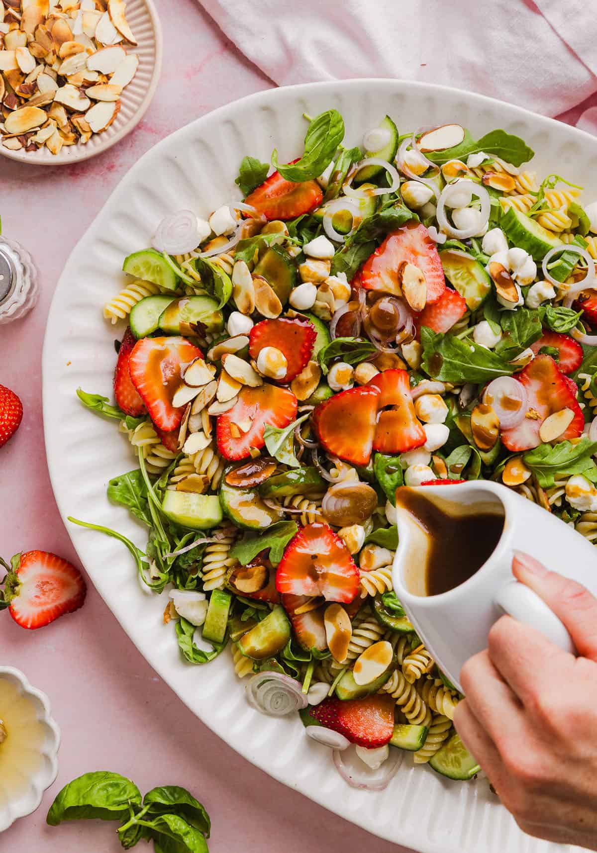 This Strawberry Balsamic Pasta Salad is fresh, flavorful, and perfect for spring and summer! Made with juicy strawberries, tender pasta, fresh basil, creamy mozzarella and crisp cucumbers all tossed in a lightly sweet balsamic dressing. 