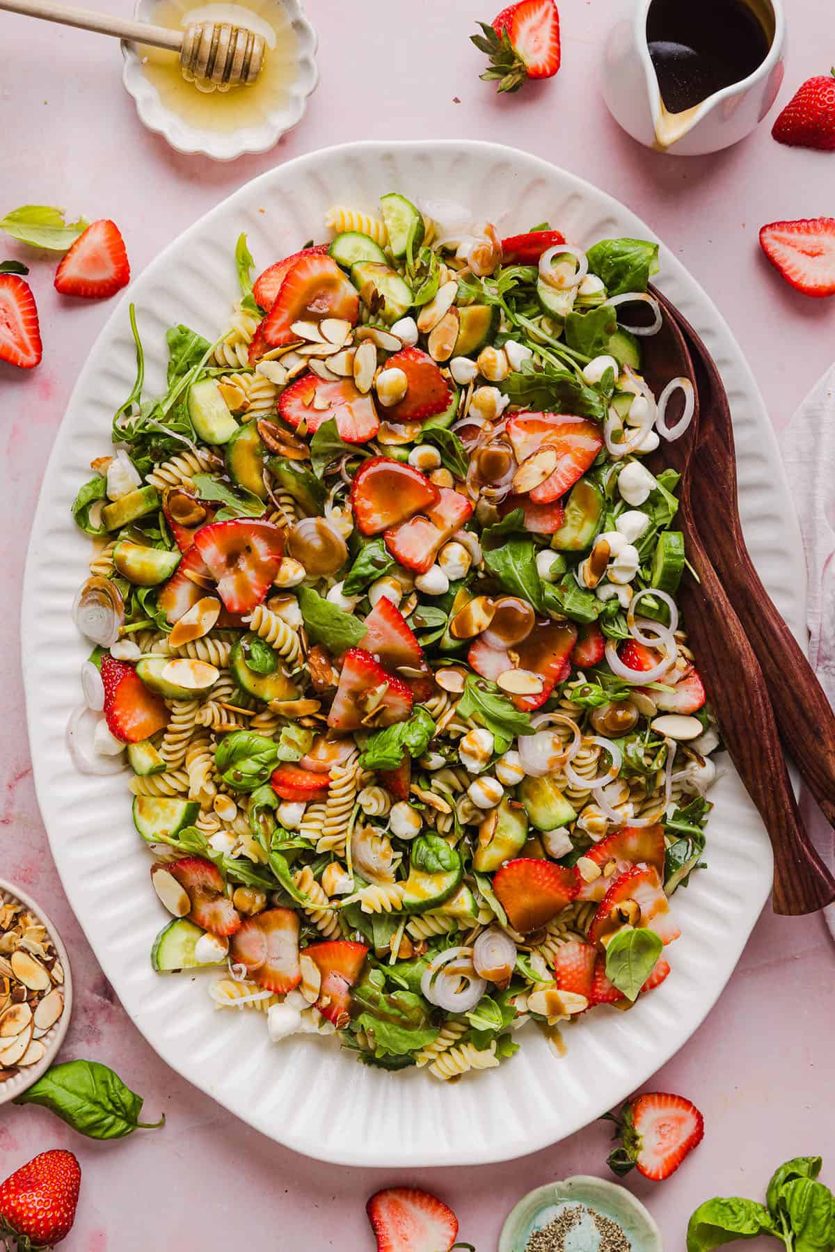 This Strawberry Balsamic Pasta Salad is fresh, flavorful, and perfect for spring and summer! Made with juicy strawberries, tender pasta, fresh basil, creamy mozzarella and crisp cucumbers all tossed in a lightly sweet balsamic dressing. 