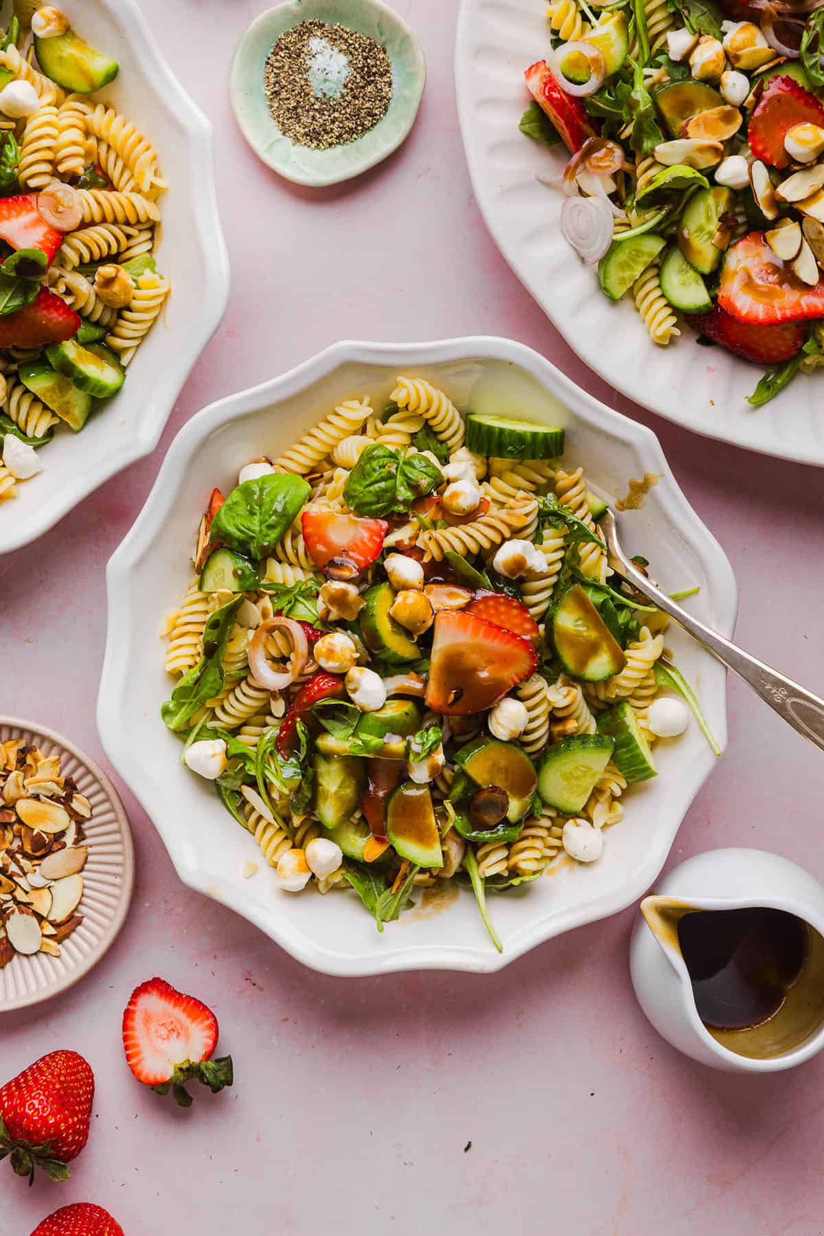 This Strawberry Balsamic Pasta Salad is fresh, flavorful, and perfect for spring and summer! Made with juicy strawberries, tender pasta, fresh basil, creamy mozzarella and crisp cucumbers all tossed in a lightly sweet balsamic dressing. 