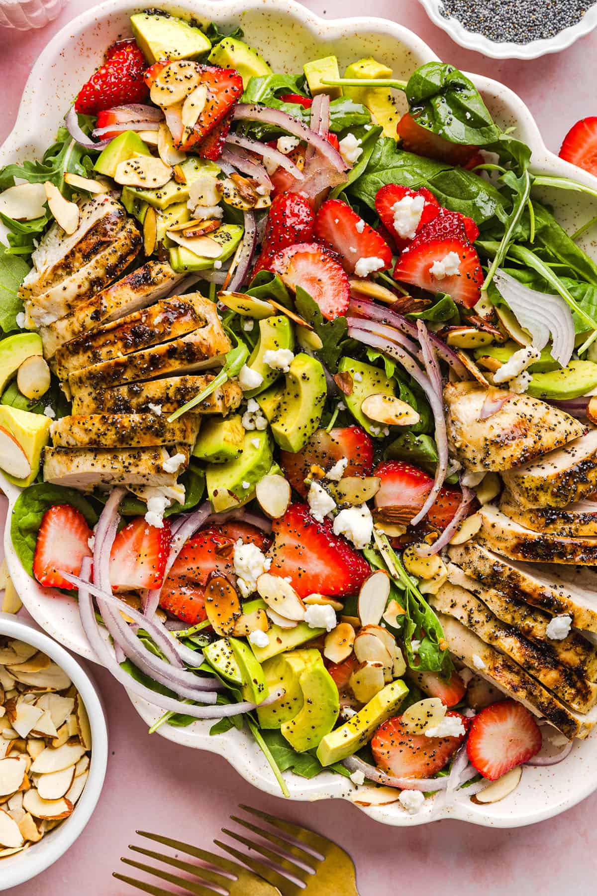 This Strawberry Poppy Seed Chicken Salad is fresh, flavorful, and perfect for spring and summer! Made with juicy strawberries, tender chicken, crunchy toppings, and the BEST poppy seed dressing.