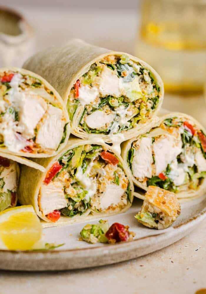 The BEST Healthy Chicken Caesar Wraps made with tender chicken, fresh romaine, a creamy homemade dressing and crispy panko crunch! An easy 20-minute lunch or dinner everyone will love!