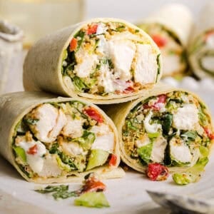 The BEST Healthy Chicken Caesar Wraps made with tender chicken, fresh romaine, a creamy homemade dressing and crispy panko crunch! An easy 20-minute lunch or dinner everyone will love!