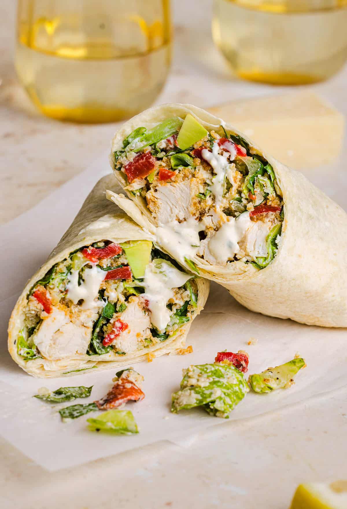 The BEST Healthy Chicken Caesar Wraps made with tender chicken, fresh romaine, a creamy homemade dressing and crispy panko crunch! An easy 20-minute lunch or dinner everyone will love!