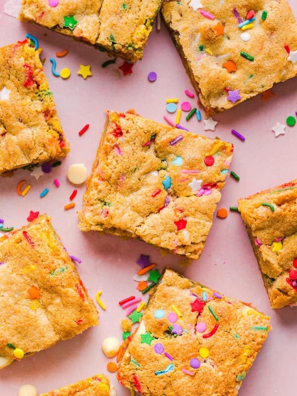 Soft and chewy Healthy Funfetti Cookie Bars that taste like birthday cake batter! Made healthier with whole wheat flour, less butter and zero refined sugar for the perfect lightened-up party dessert!