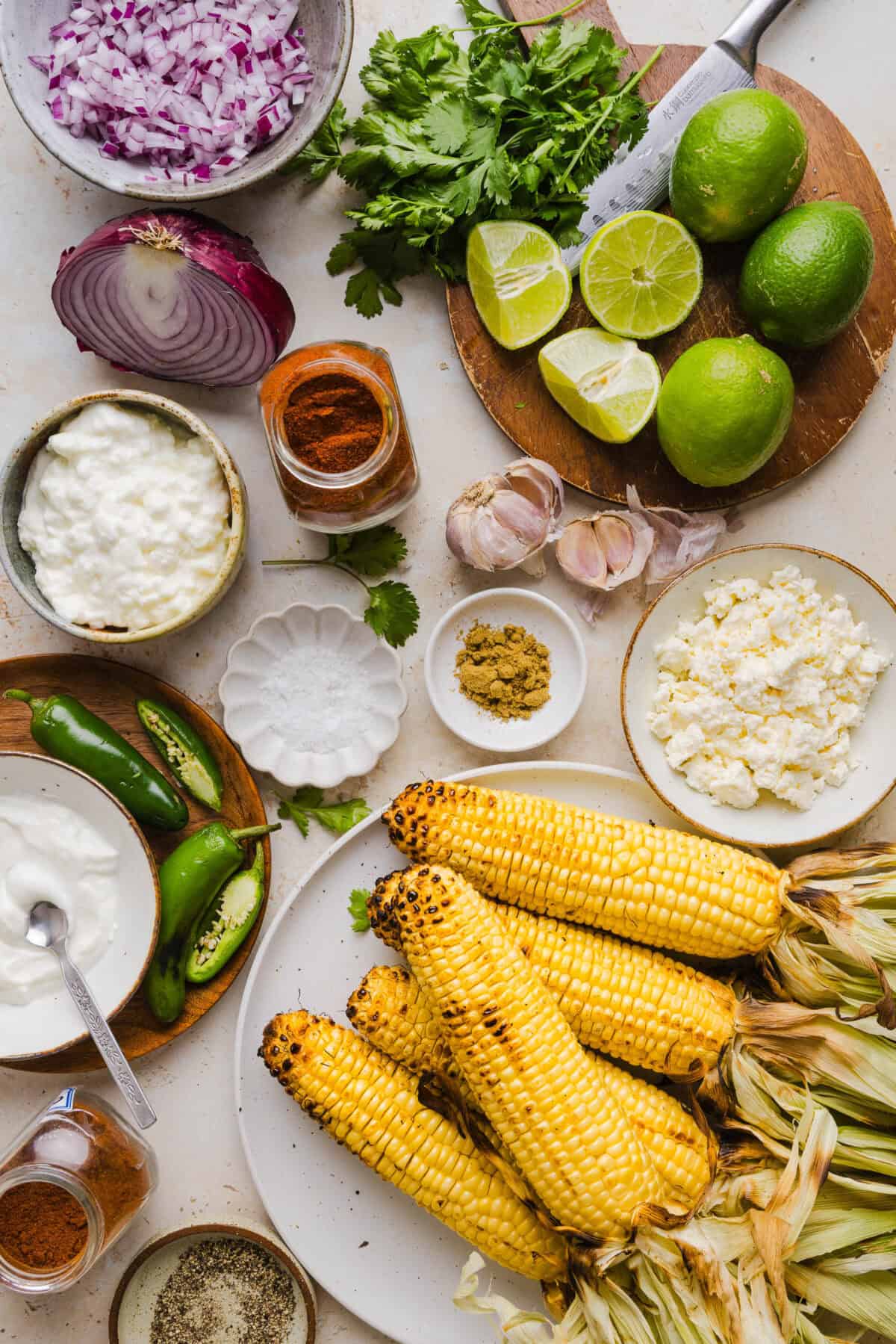 This Healthy Mexican Street Corn Salad is a fresh and flavorful summer side dish loaded with sweet grilled corn, cotija cheese, cilantro, jalapeño, and a creamy protein-packed lime dressing. Perfect for cookouts, taco nights and meal prep!
