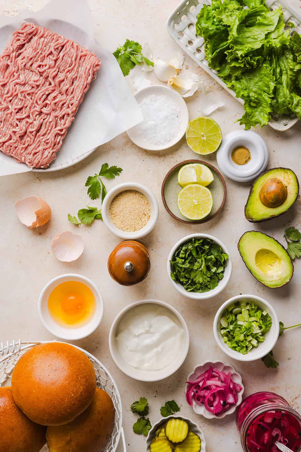 These Cilantro Lime Chicken Burgers are juicy, flavorful, and topped with a creamy avocado cilantro sauce. Made with lean ground chicken, fresh cilantro, green onions, and lime zest, these burgers are perfect for summer grilling or an easy weeknight meal!
