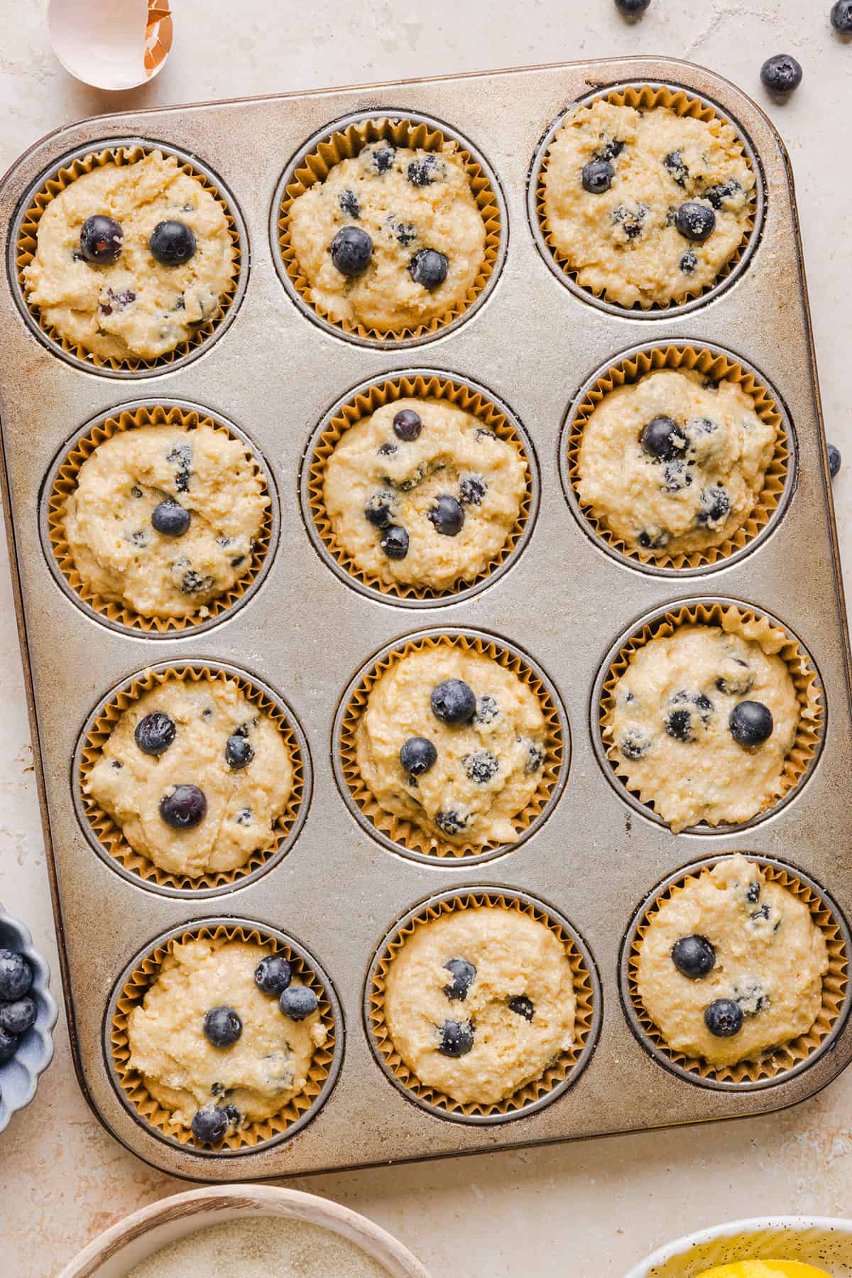 These Lemon Blueberry Yogurt Muffins are soft, moist and bursting with fresh lemon flavor and juicy blueberries! Made with Greek yogurt and wholesome ingredients, they are perfect for breakfast, snacks or meal prep.