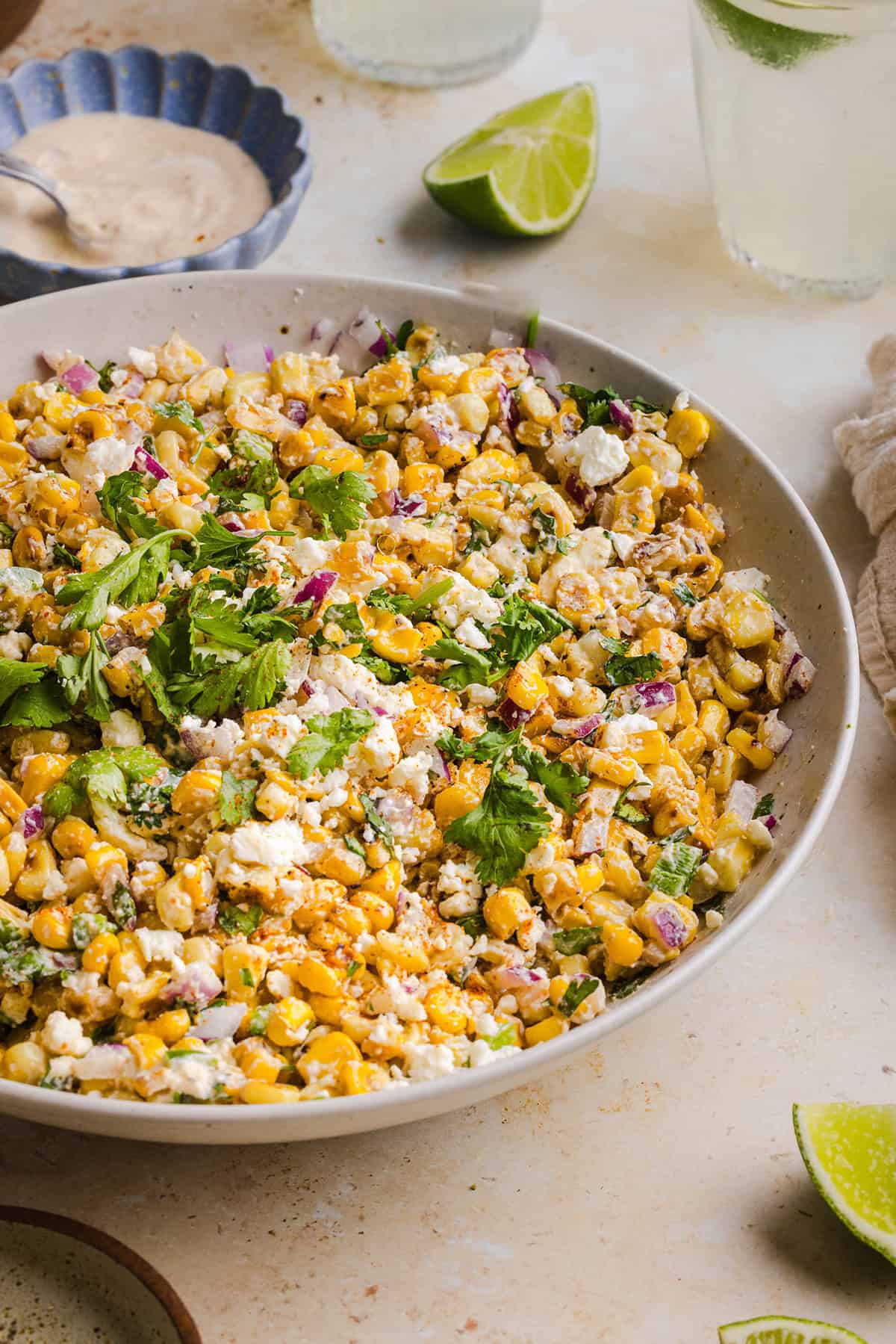 This Healthy Mexican Street Corn Salad is a fresh and flavorful summer side dish loaded with sweet grilled corn, cotija cheese, cilantro, jalapeño, and a creamy protein-packed lime dressing. Perfect for cookouts, taco nights and meal prep!