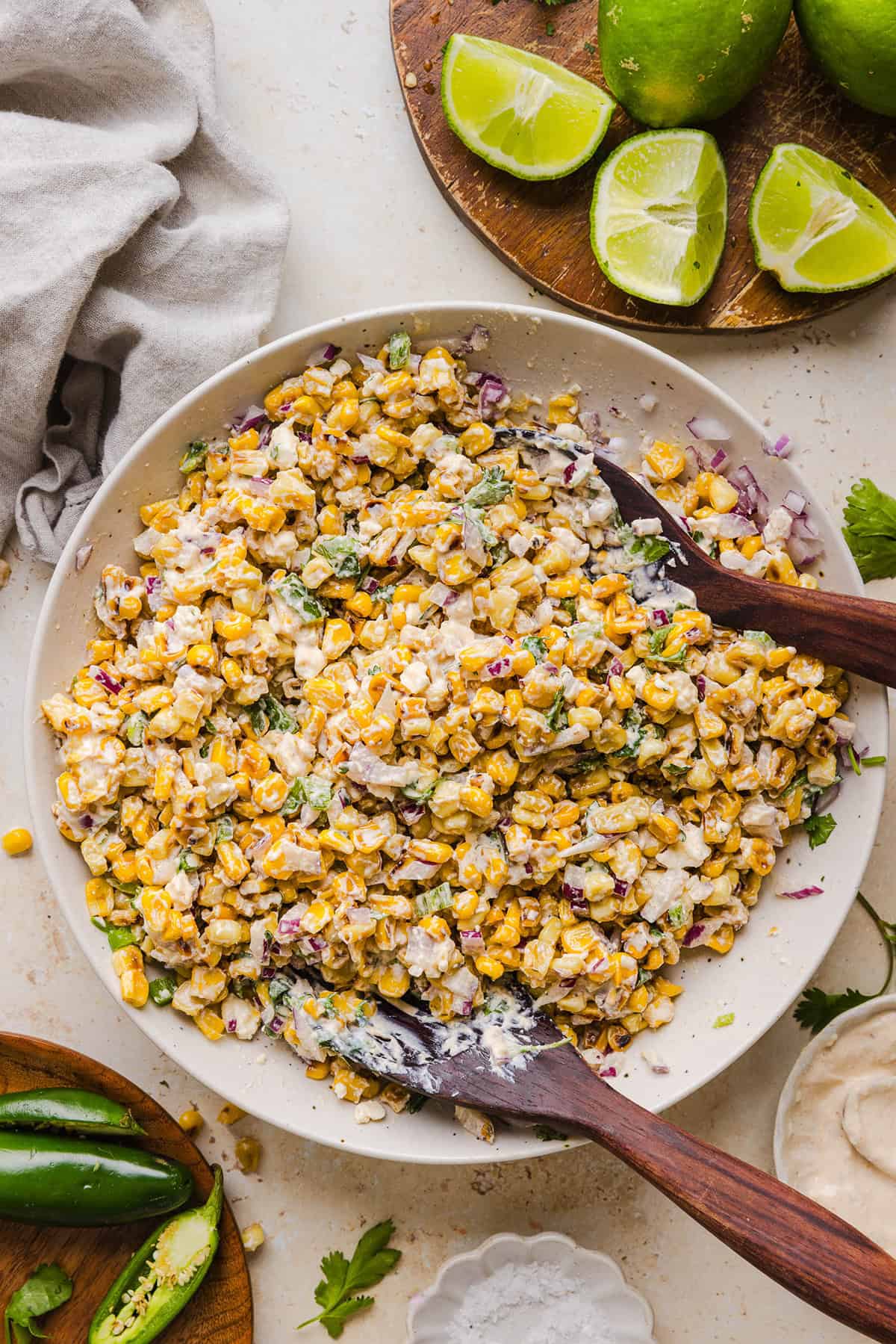 This Healthy Mexican Street Corn Salad is a fresh and flavorful summer side dish loaded with sweet grilled corn, cotija cheese, cilantro, jalapeño, and a creamy protein-packed lime dressing. Perfect for cookouts, taco nights and meal prep!