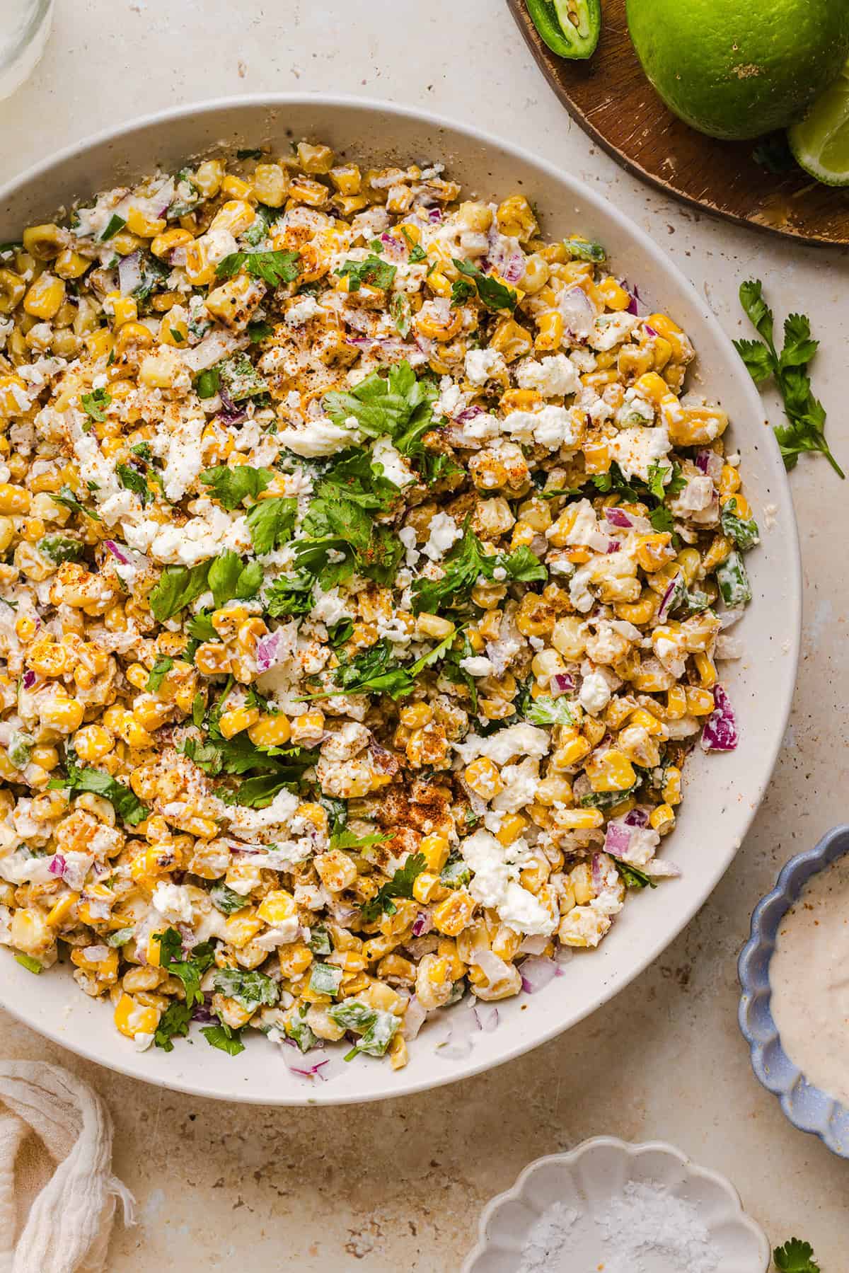 This Healthy Mexican Street Corn Salad is a fresh and flavorful summer side dish loaded with sweet grilled corn, cotija cheese, cilantro, jalapeño, and a creamy protein-packed lime dressing. Perfect for cookouts, taco nights and meal prep!
