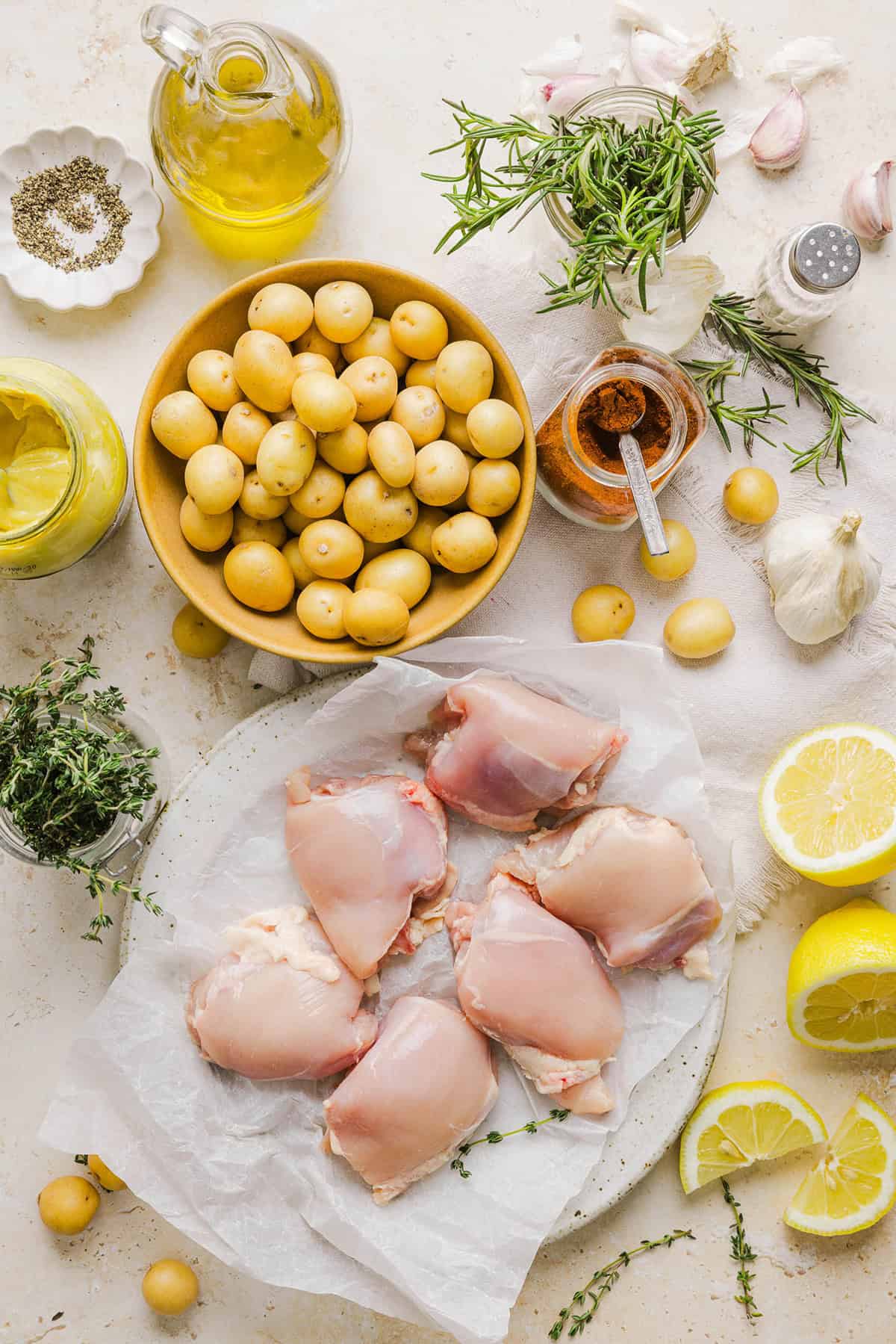 Make dinner easy with this Sheet Pan Lemon Herb Chicken and Potatoes recipe! Tender lemon rosemary chicken thighs and crispy roasted potatoes come together on one pan for a flavorful, family-friendly meal with minimal cleanup.