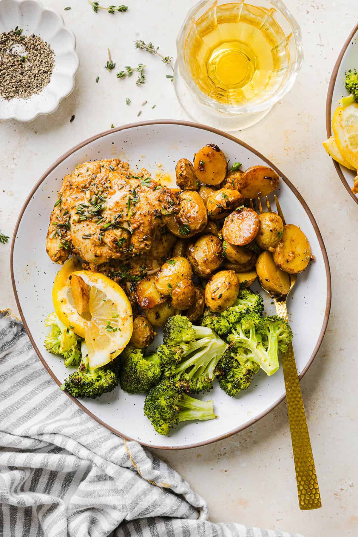 Make dinner easy with this Sheet Pan Lemon Herb Chicken and Potatoes recipe! Tender lemon rosemary chicken thighs and crispy roasted potatoes come together on one pan for a flavorful, family-friendly meal with minimal cleanup.