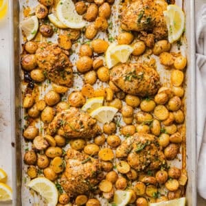 Make dinner easy with this Sheet Pan Lemon Herb Chicken and Potatoes recipe! Tender lemon rosemary chicken thighs and crispy roasted potatoes come together on one pan for a flavorful, family-friendly meal with minimal cleanup.