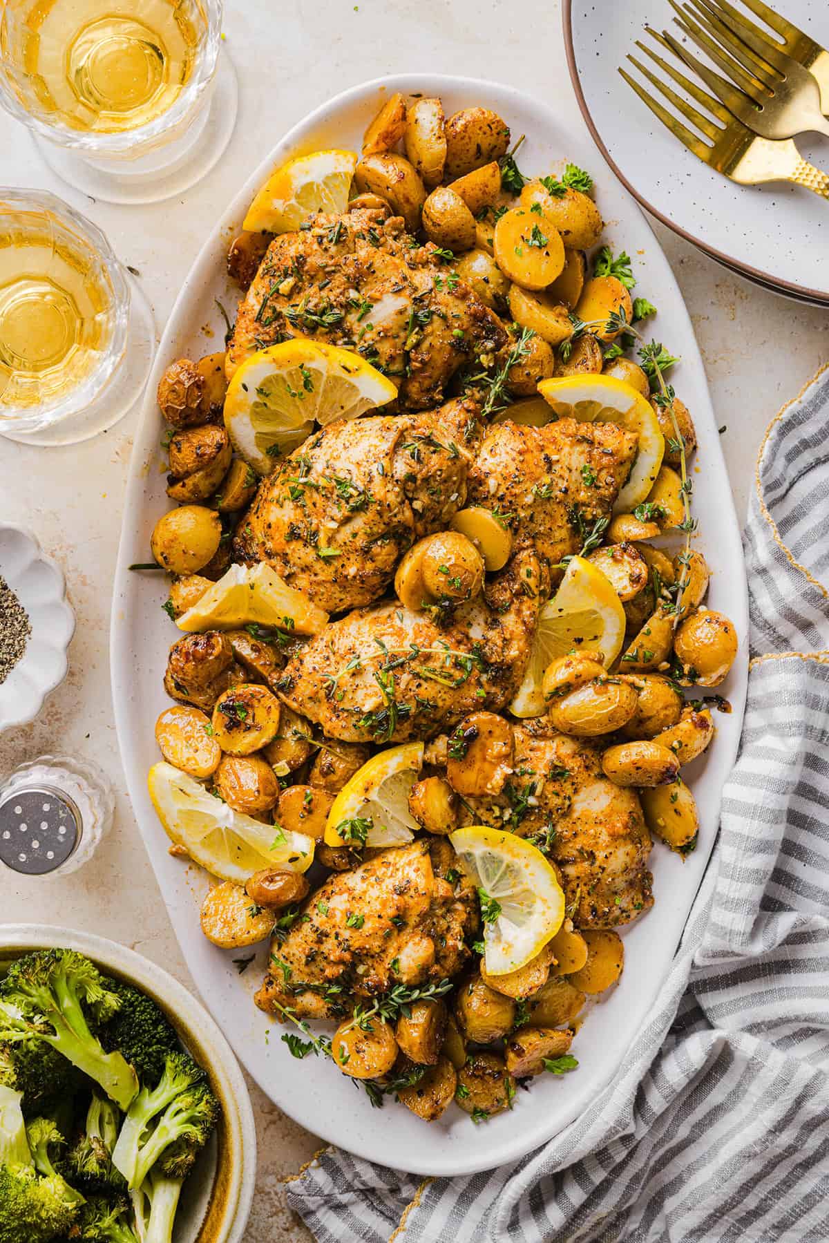 Make dinner easy with this Sheet Pan Lemon Herb Chicken and Potatoes recipe! Tender lemon rosemary chicken thighs and crispy roasted potatoes come together on one pan for a flavorful, family-friendly meal with minimal cleanup.