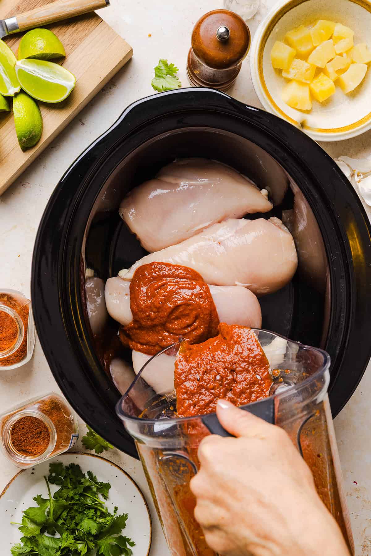 These Crock Pot Chicken Al Pastor Tacos are sweet, smoky, and incredibly flavorful! An easy slow cooker dinner made with juicy shredded chicken, fresh pineapple, chipotle peppers, and warm spices for a healthy, protein-packed dinner.