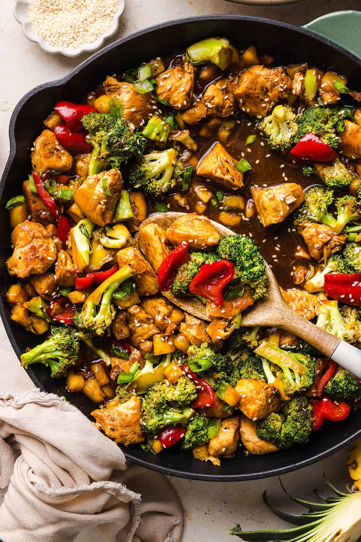 Skip the takeout with this Easy Pineapple Teriyaki Chicken Stir Fry! Made with juicy chicken, fresh pineapple, crisp veggies, and a healthy homemade teriyaki sauce in just 30 minutes.