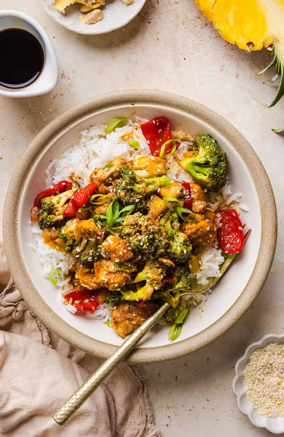 Skip the takeout with this Easy Pineapple Teriyaki Chicken Stir Fry! Made with juicy chicken, fresh pineapple, crisp veggies, and a healthy homemade teriyaki sauce in just 30 minutes.