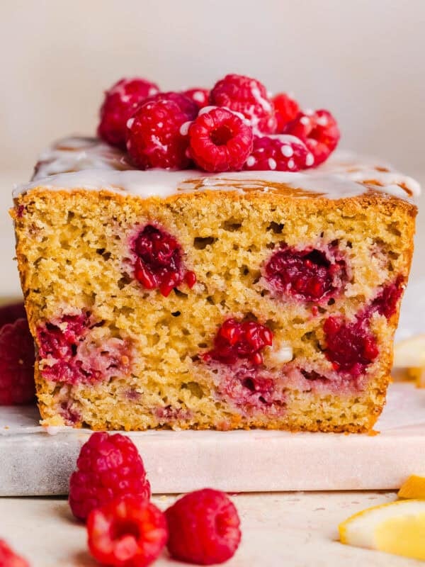 Make the BEST Raspberry Lemon Yogurt Bread with fresh raspberries, protein-packed Greek yogurt, and bright lemon flavor. This moist, wholesome quick bread is perfect for breakfast, brunch or dessert!