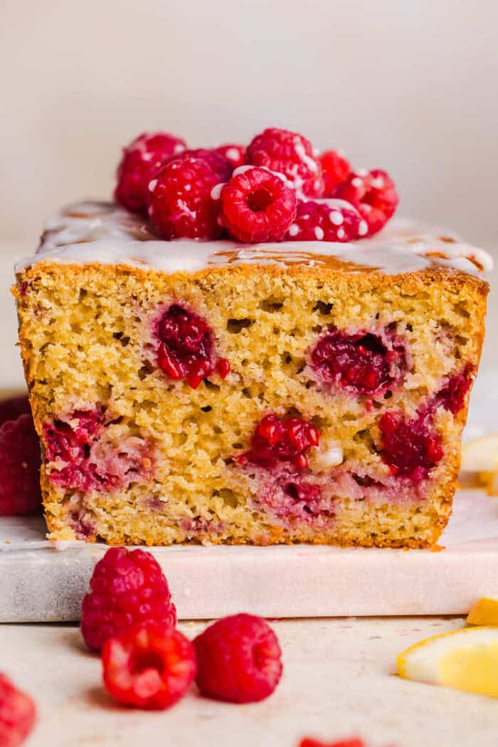 Make the BEST Raspberry Lemon Yogurt Bread with fresh raspberries, protein-packed Greek yogurt, and bright lemon flavor. This moist, wholesome quick bread is perfect for breakfast, brunch or dessert!