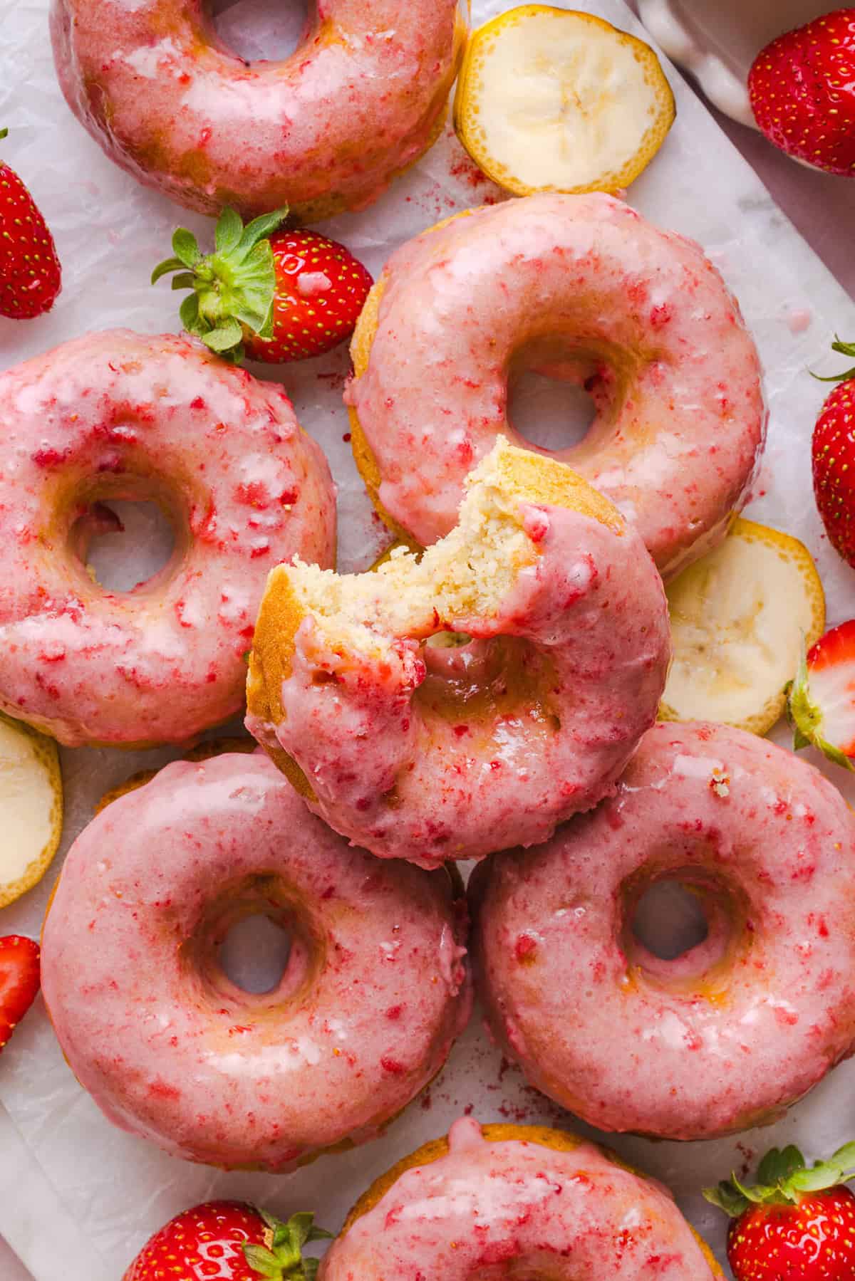 These Gluten-Free Strawberry Banana Donuts are soft, fluffy, and naturally sweetened with ripe bananas and fresh strawberries. These donuts are baked, not fried, and topped with a sweet strawberry glaze!