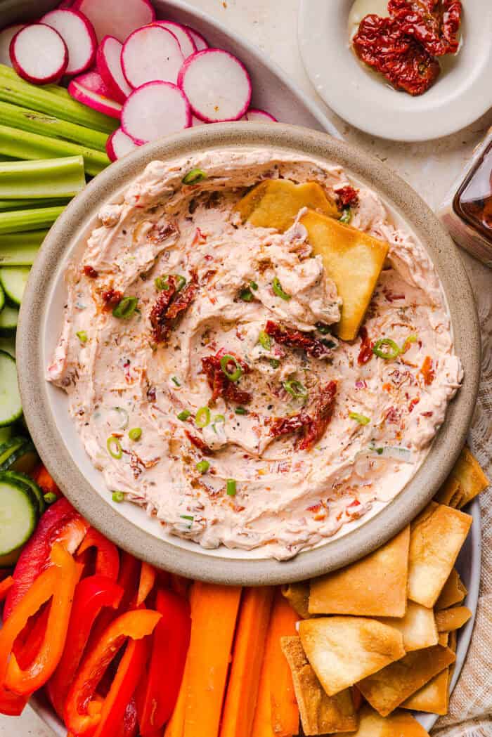 The BEST Creamy Sun-Dried Tomato Dip recipe made with protein-packed Greek yogurt, cream cheese, garlic, and bell peppers. Easy to make, perfect for parties, and ready in just minutes!