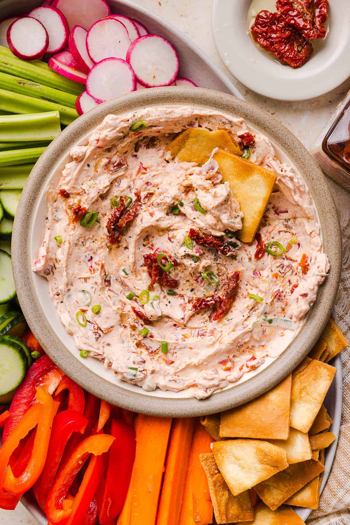 The BEST Creamy Sun-Dried Tomato Dip recipe made with protein-packed Greek yogurt, cream cheese, garlic, and bell peppers. Easy to make, perfect for parties, and ready in just minutes!