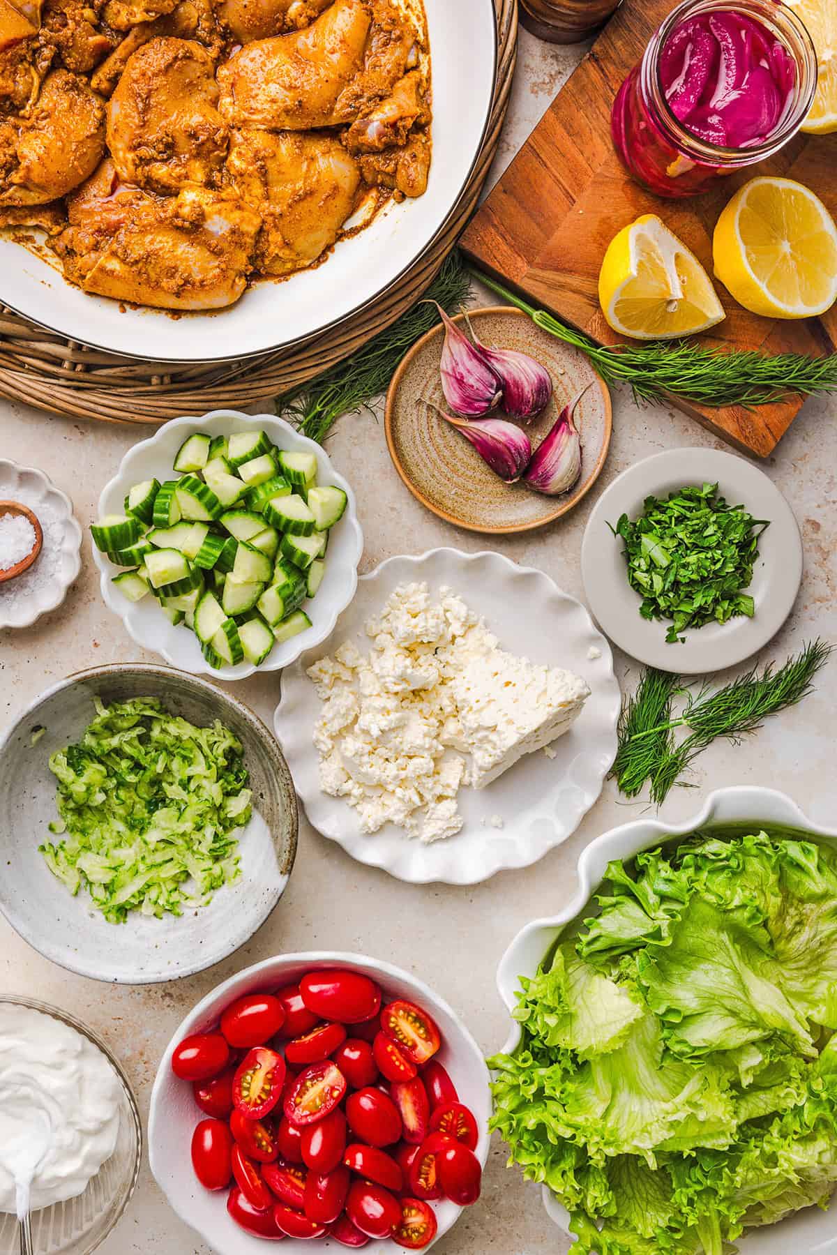 These Easy Chicken Shawarma Bowls are loaded with juicy spiced chicken, fluffy rice, fresh veggies, feta and creamy homemade tzatziki! A healthy, flavor-packed meal that is great for meal prep!