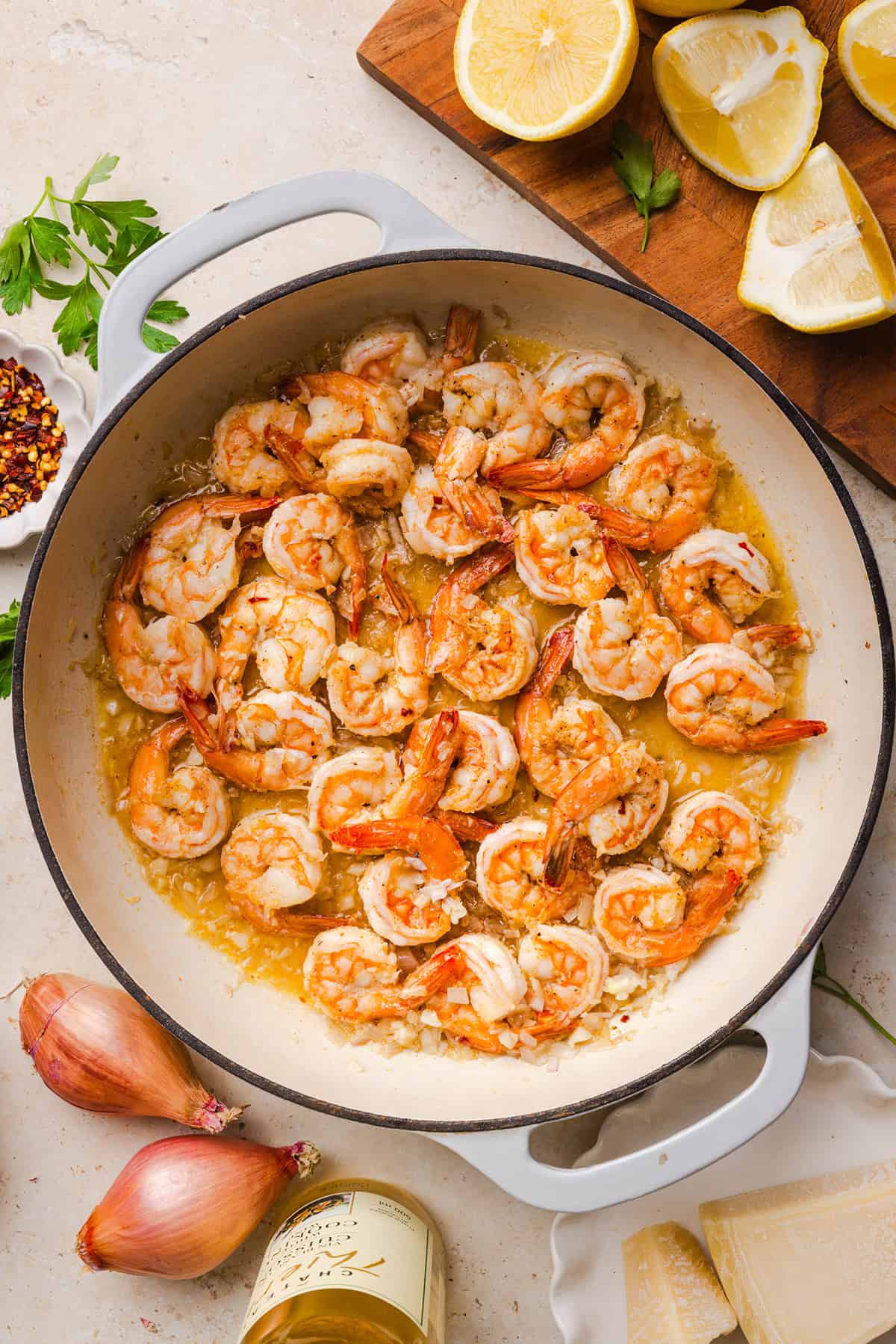 The BEST Healthy Shrimp Scampi recipe lightened up without sacrificing flavor! Juicy shrimp, garlic, lemon, white wine, and Parmesan are tossed with tender linguine in a silky, buttery sauce that’s ready in just 30 minutes.