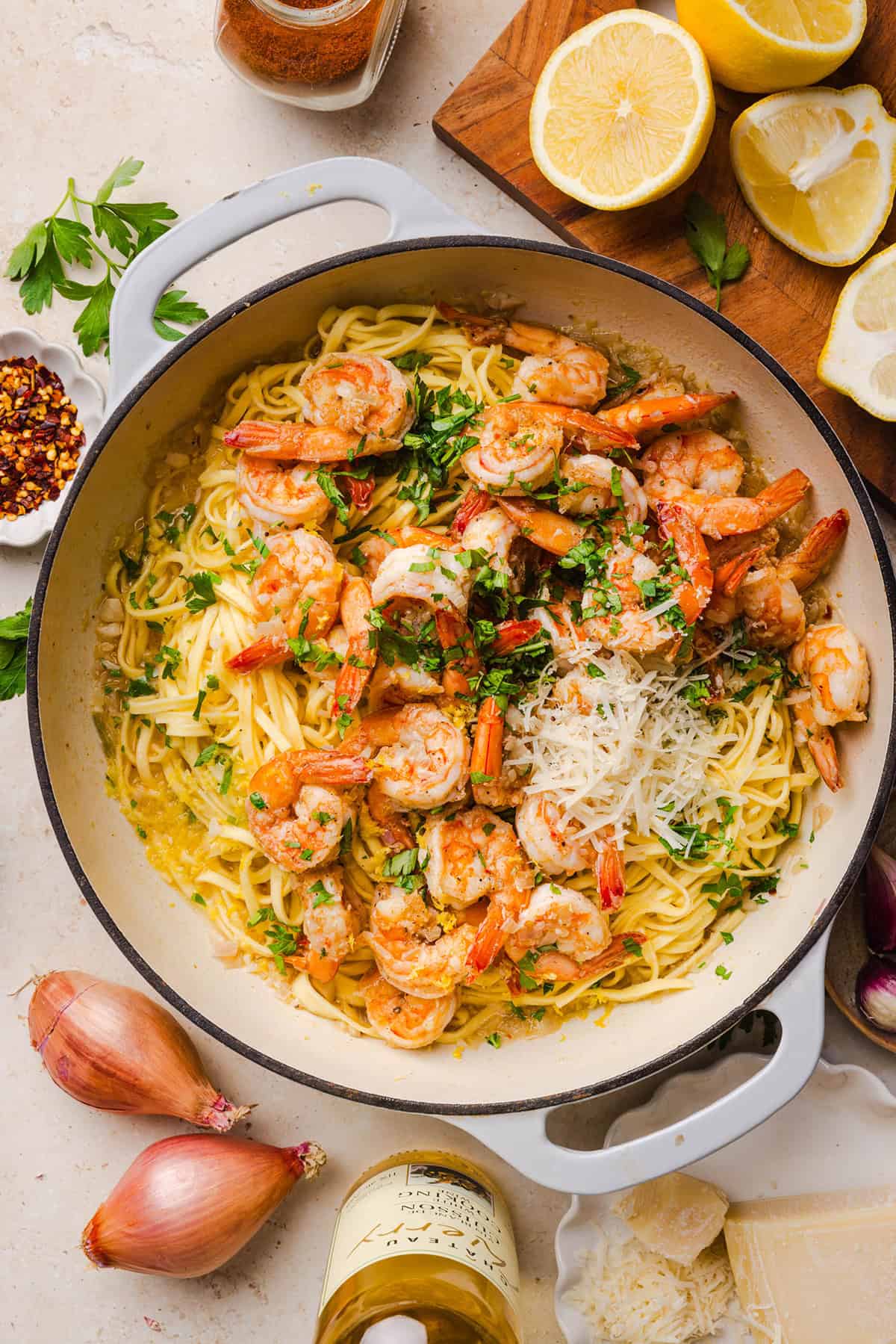 The BEST Healthy Shrimp Scampi recipe lightened up without sacrificing flavor! Juicy shrimp, garlic, lemon, white wine, and Parmesan are tossed with tender linguine in a silky, buttery sauce that’s ready in just 30 minutes.
