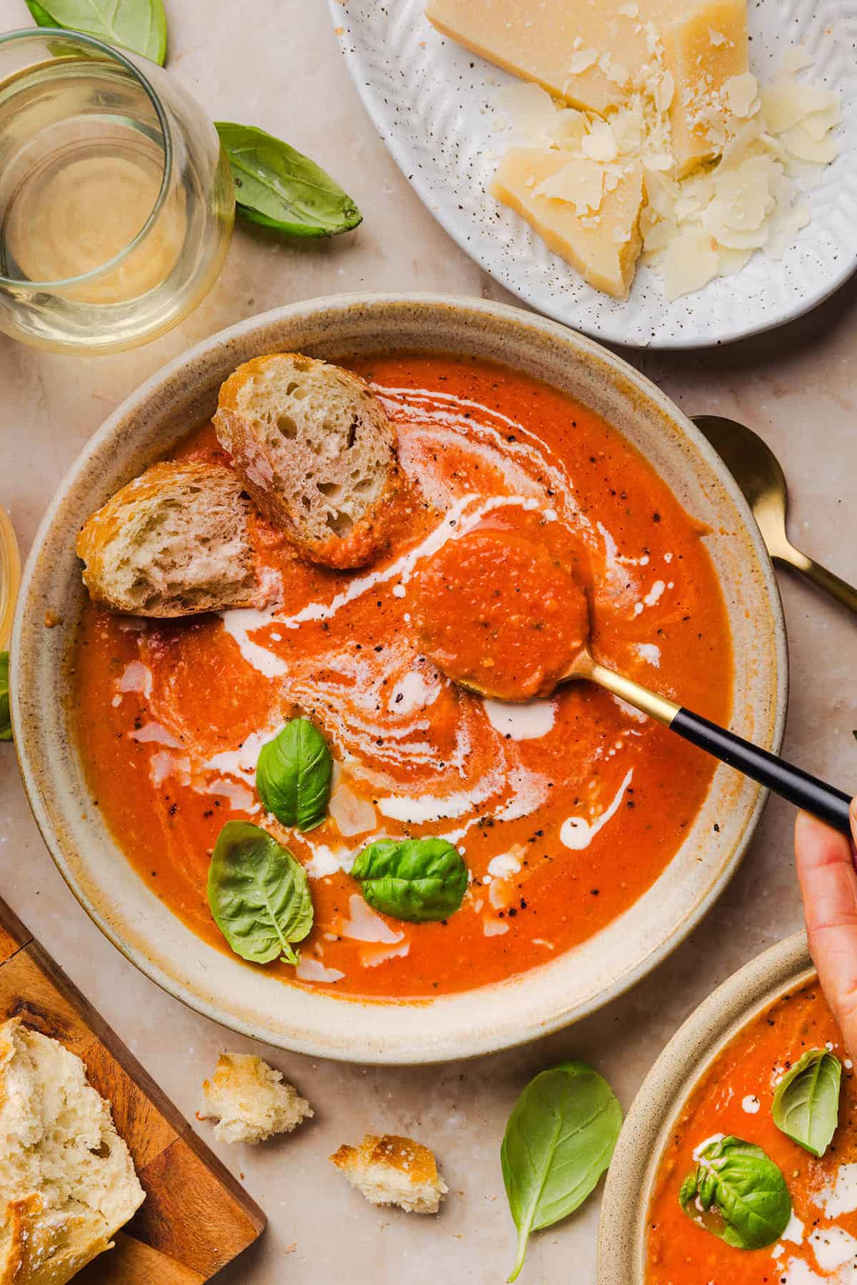 Creamy tomato soup in a bowl ready to enjoy with a spoon