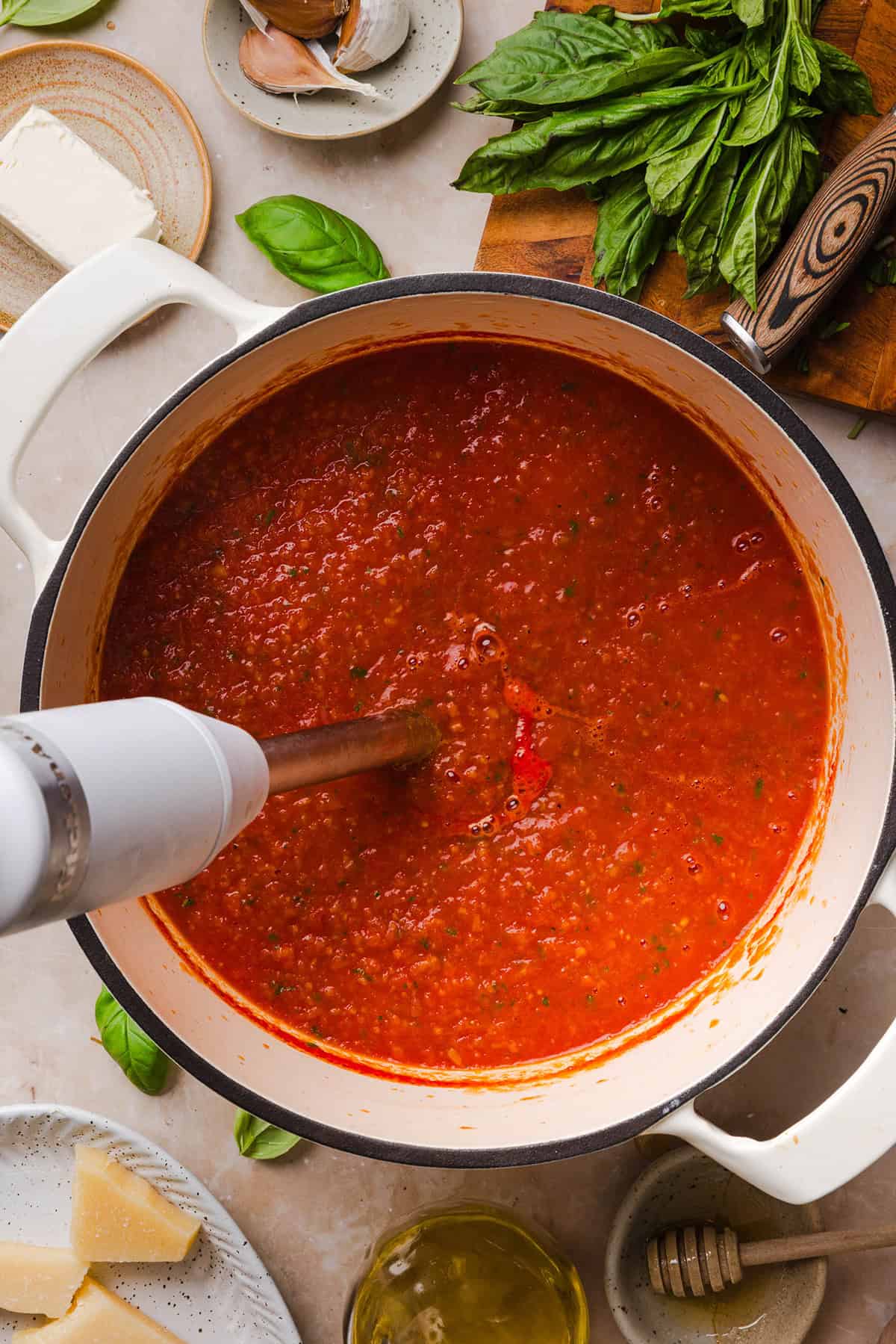 Blending the creamy tomato basil soup in the pot