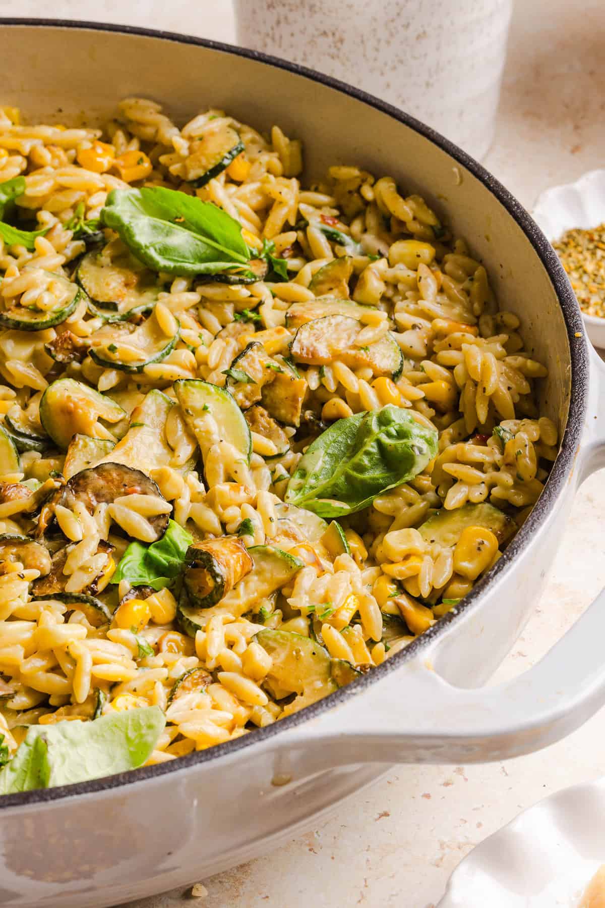 This creamy One Pan Lemon Garlic Orzo with Zucchini and Corn is fresh, flavorful and made in one skillet for an easy summer side dish or weeknight meal. Packed with fresh veggies, tender orzo, Parmesan, herbs and bright lemon flavor!