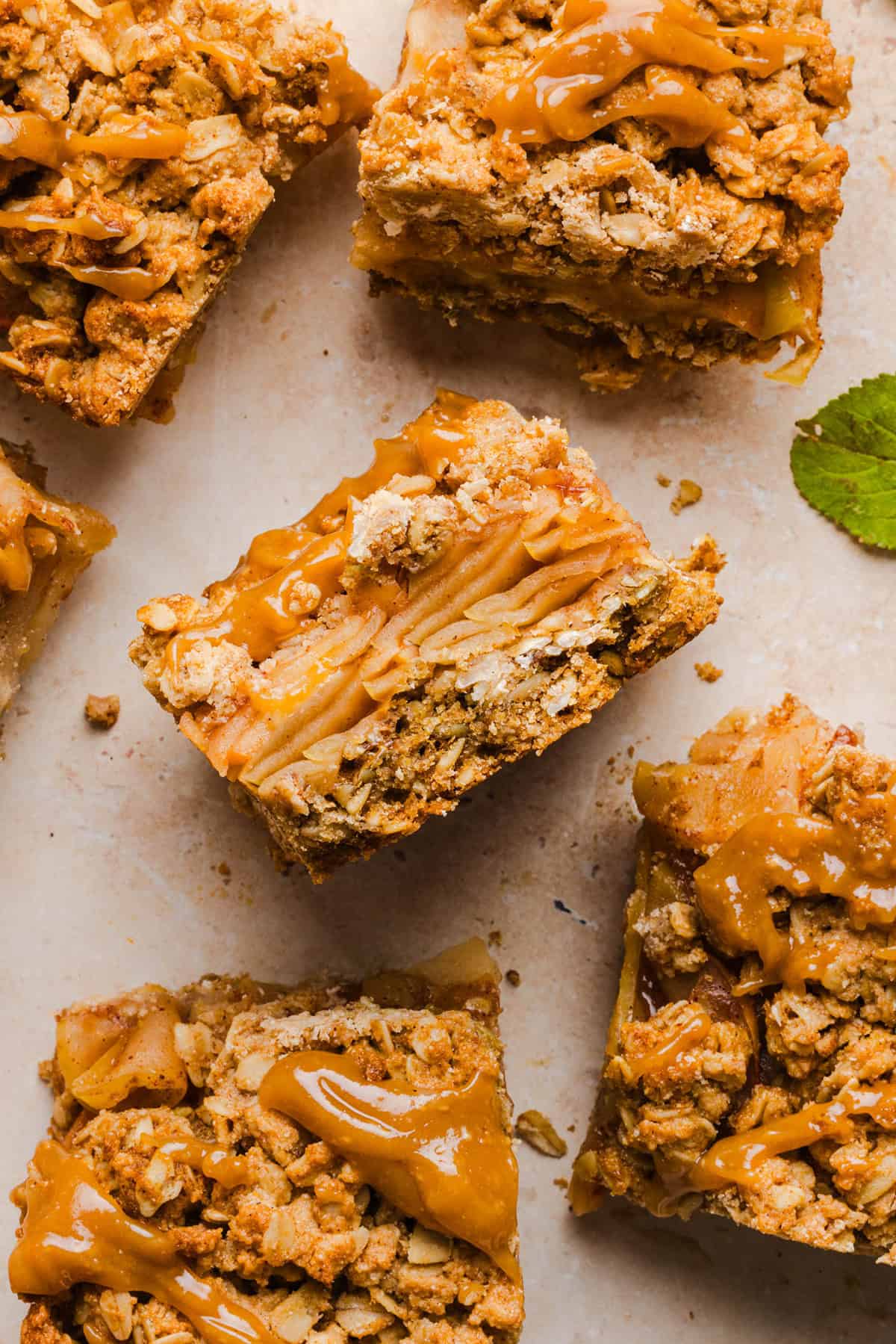 Close-up of an apple pie crumble bar showing the cinnamon apple filling