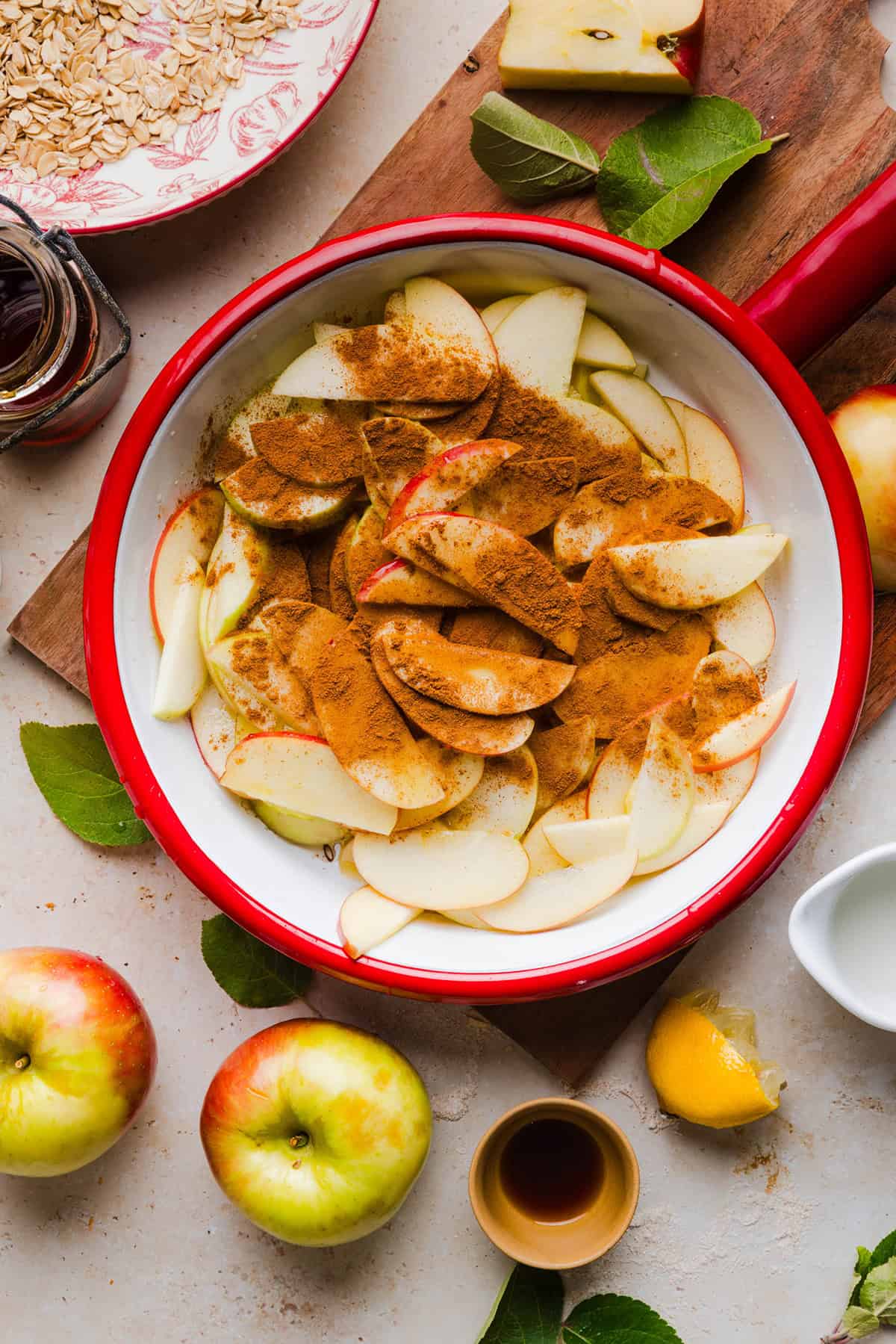 Sliced apples tossed with cinnamon, nutmeg and maple syrup to make the filling.