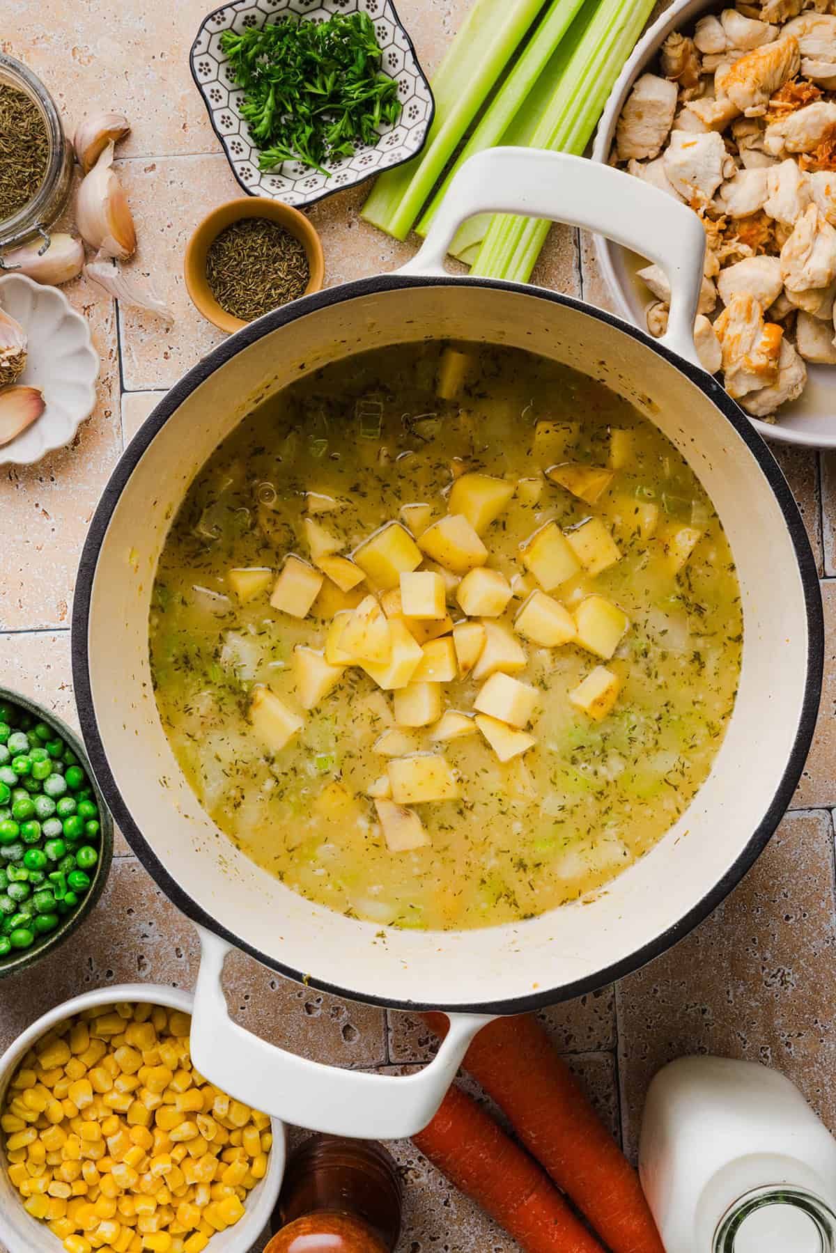 This Healthy Chicken Pot Pie Soup has all the cozy flavors of classic chicken pot pie in an easy, one-pot dinner! It’s loaded with tender chicken, potatoes, carrots, peas and corn in a creamy, herb-seasoned broth made without heavy cream.