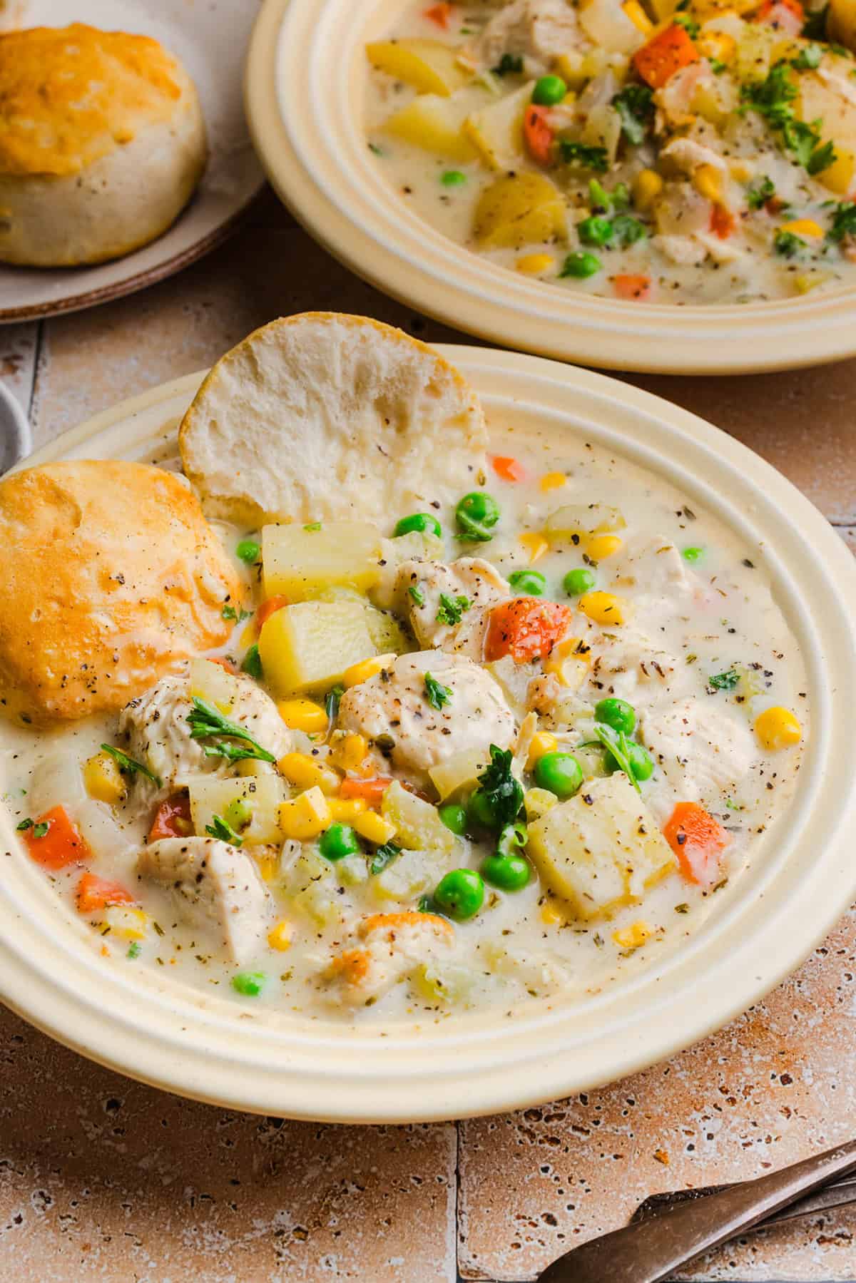 This Healthy Chicken Pot Pie Soup has all the cozy flavors of classic chicken pot pie in an easy, one-pot dinner! It’s loaded with tender chicken, potatoes, carrots, peas and corn in a creamy, herb-seasoned broth made without heavy cream.
